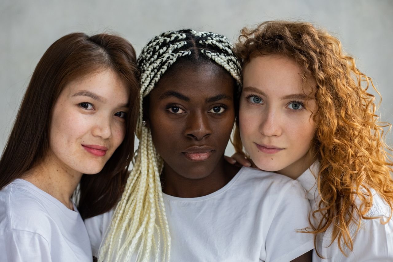 Services Unique multiethnic females with different hairstyles and appearances representing concept of unity and tolerance looking at camera